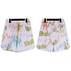 Rhude White All‑Over Multicolor Logo Shorts